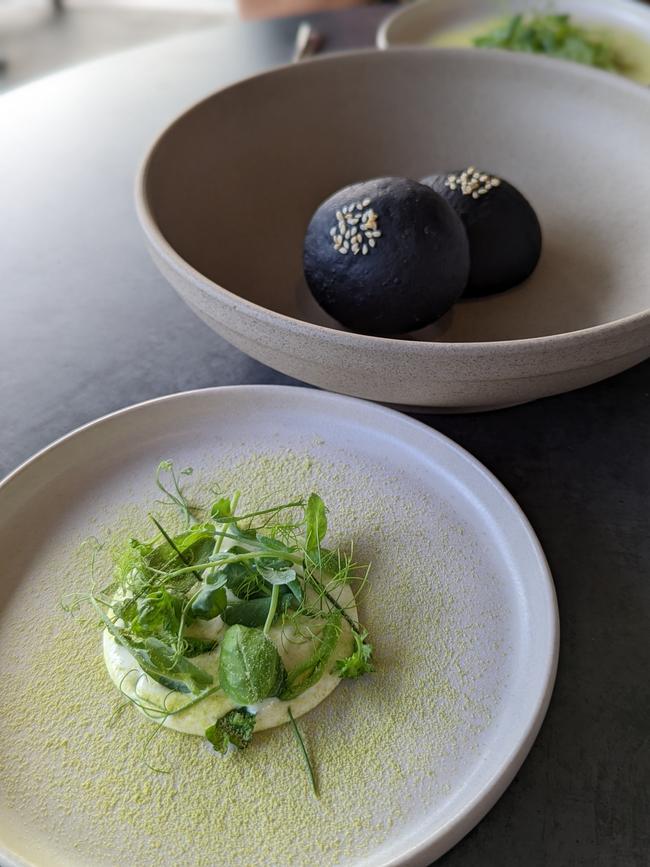 Charcoal sweet bun and oyster crema with seasonal greens at Muni. Picture: Hanmo Li