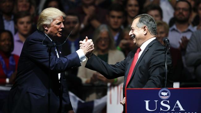 President-elect Donald Trump thanks Dow Chemical Company Chairman and Chief Executive Officer Andrew Liveris during a rally in Grand Rapids, Michigan last week. Picture: AP/Paul Sancya