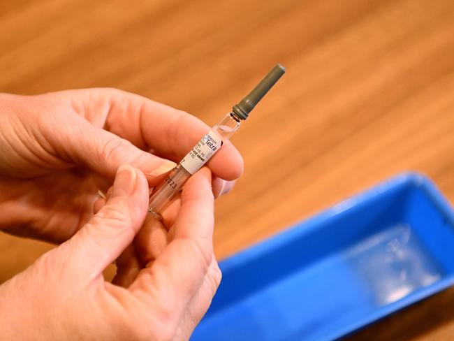 BRISBANE, AUSTRALIA - NewsWire Photos - APRIL 13, 2023.A nurse holds a syringe containing the flu vaccination. The Government is encouraging Queenslanders to get their flu jab ahead of winter.Picture: Dan Peled / NCA NewsWire