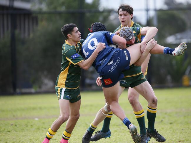 Mitchell Hayes is up ended by the Wolves defence. Photographer: Warren Gannon Photography