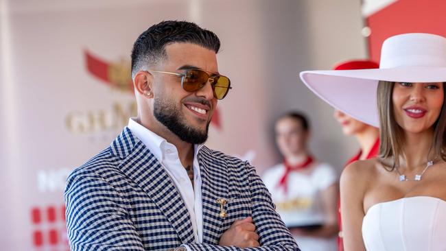 Lambo Guy Adrian Portelli with partner Karlie Butler at the Melbourne Cup. Picture: Jason Edwards