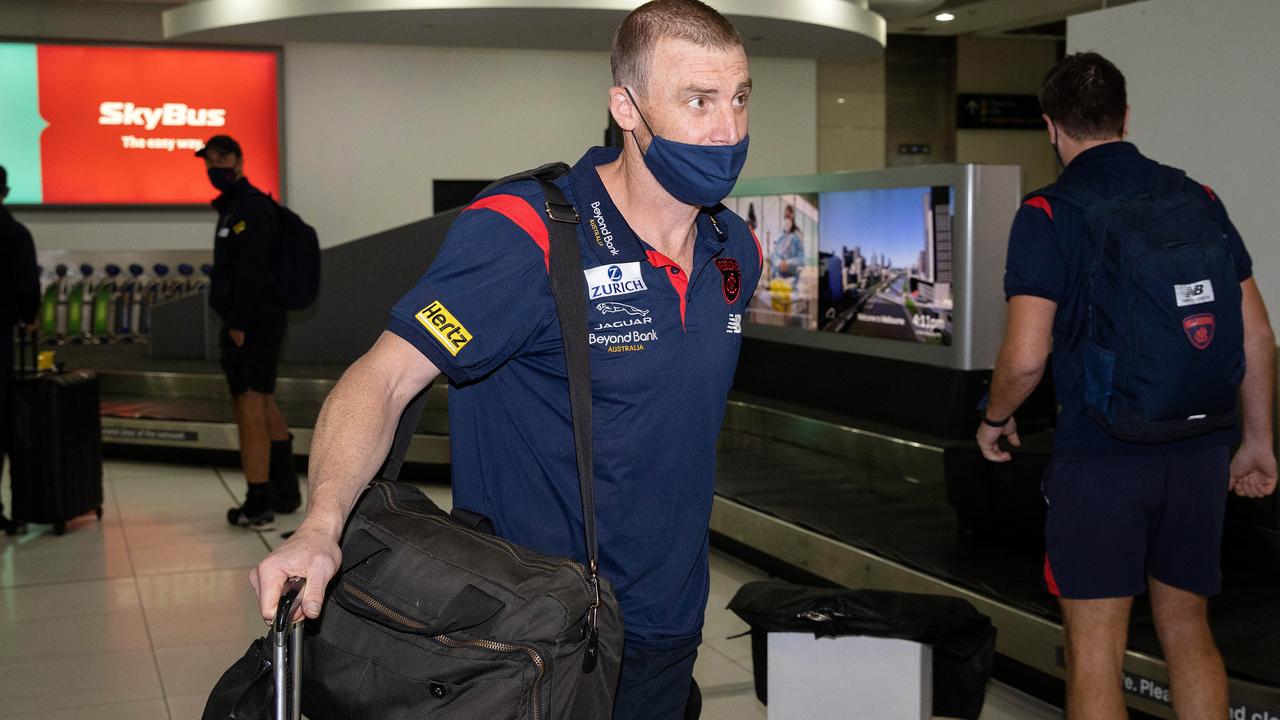 Victorious premiership coach Simon Goodwin collects his luggage. Picture: Mark Stewart