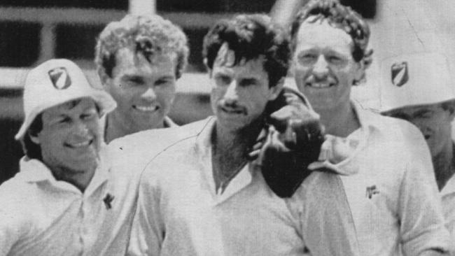 The great Richard Hadlee is congratulated by his New Zealand teammates after taking 9-52 against Australia at the Gabba in 1985. Picture: Simon Rennilson