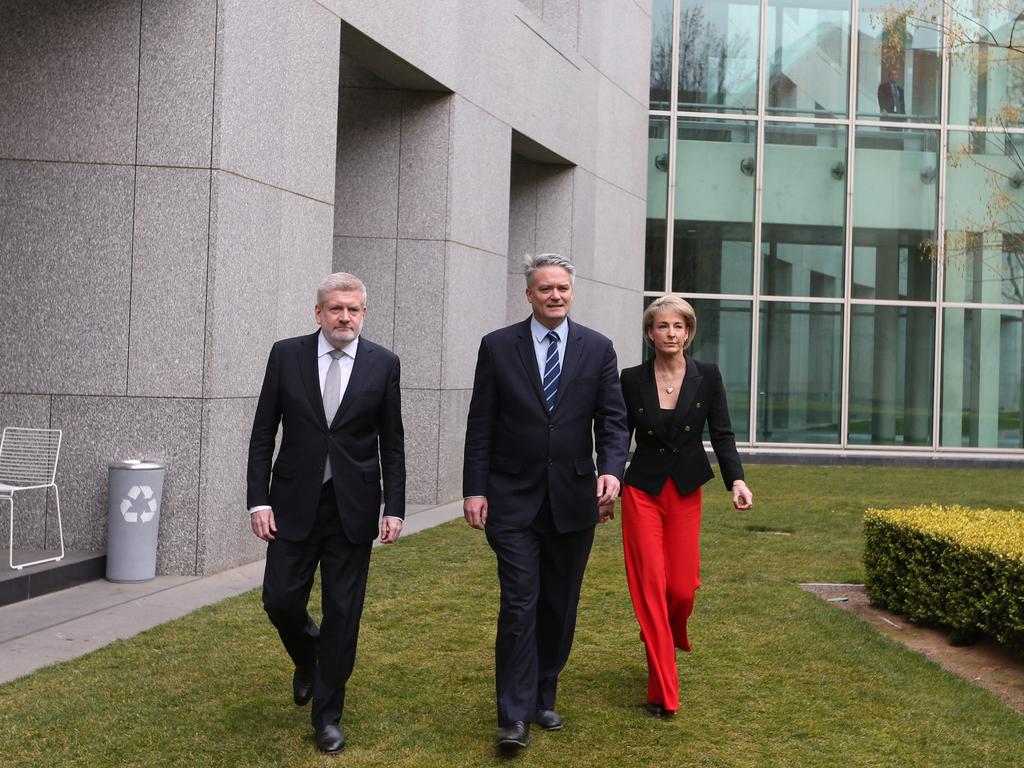 Mitch Fifield, Mathias Cormann and Michealia Cash holding a press conference at Parliament House in Canberra.