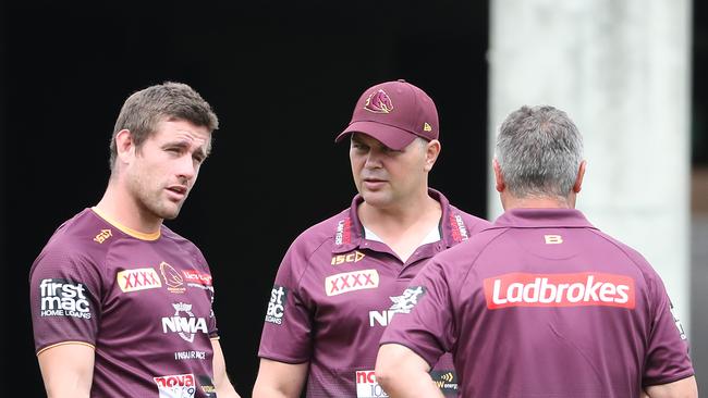 Broncos caretaker Peter Gentle says he prefers hands-on coaching helping players, such as Andrew McCullough, left, in an assistant’s role. Picture: Peter Wallis