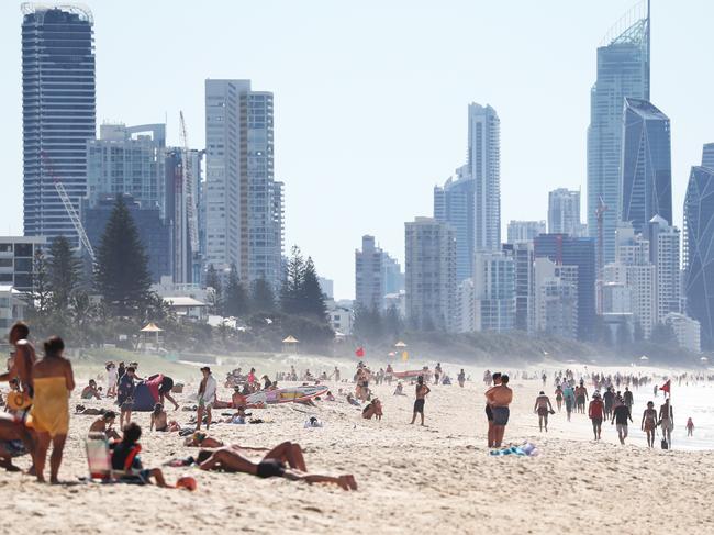 People on the beach at Broadbeach on the Gold Coast.Photograph : Jason O'Brien