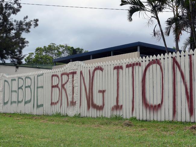 A painted message directed at oncoming Tropical Cyclone Debbie is seen on the front fence of the house of builder Graham Wilson in Bowen. Monday, March 27, 2017. Picture: AAP Image/Sarah Motherwell