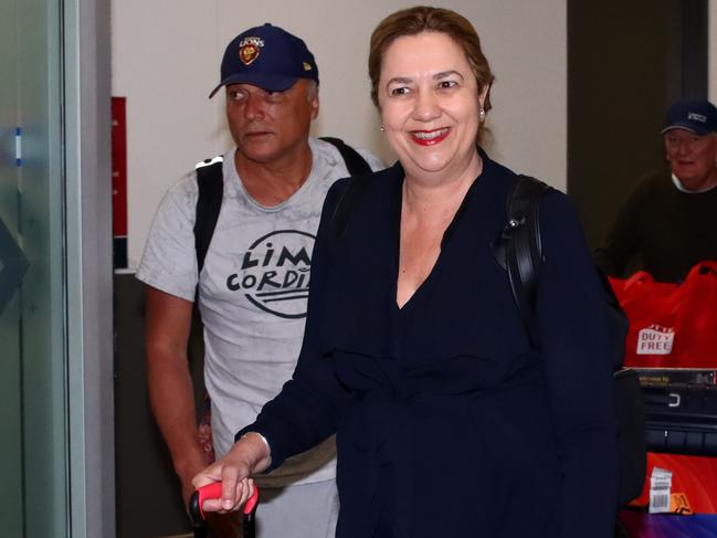 Premier Annastacia Palaszczuk arrives at Brisbane International Airport late on Sunday night with partner Dr Reza Adib after a two-week European holiday. Picture: David Clark