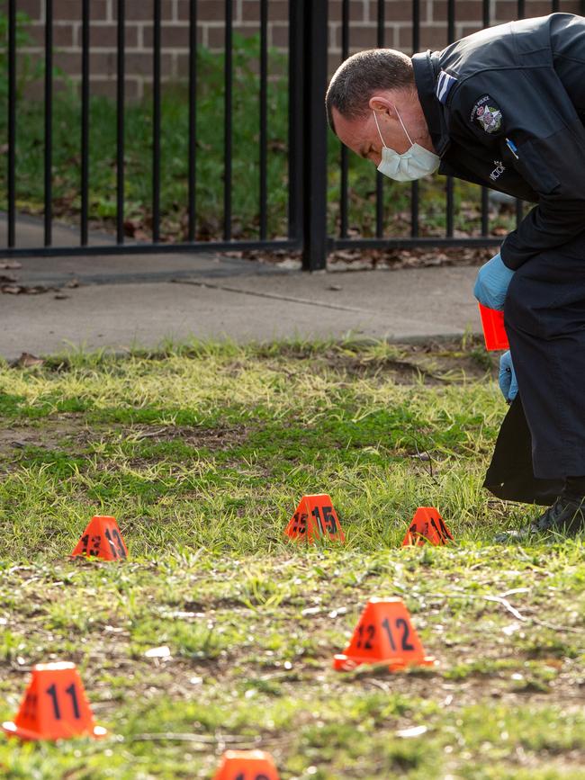 An officer labels evidence at the scene. Picture: Jay Town