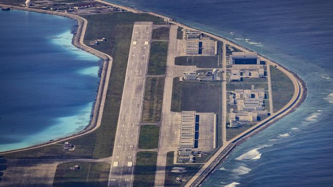 An airfield, buildings, and structures are seen on the artificial island built by China in Mischief Reef in Spratly Islands, South China Sea. Picture: Getty Images