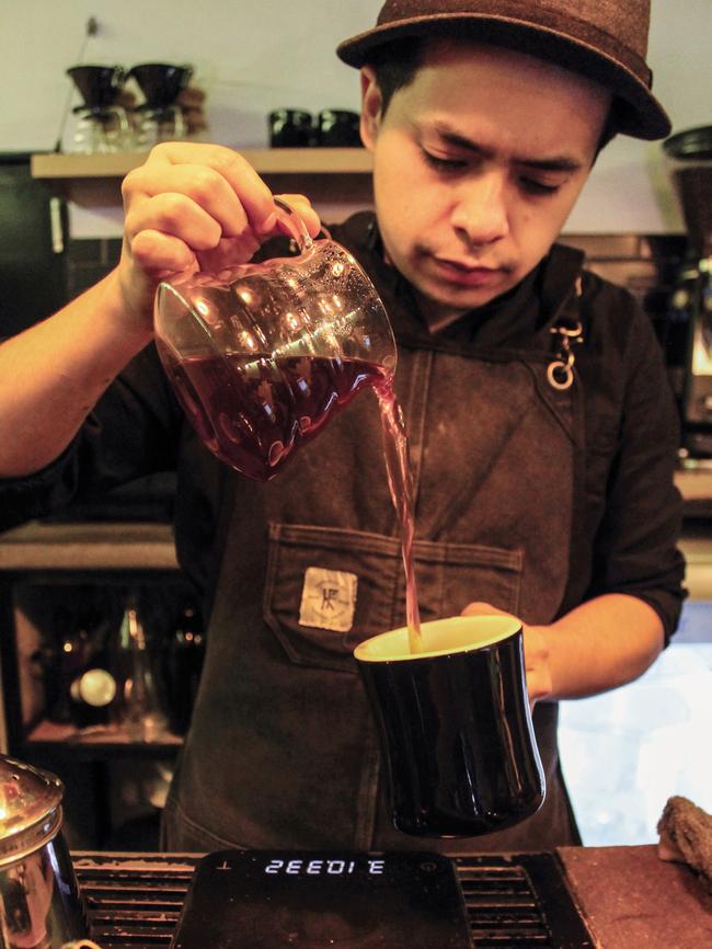 A coffee is prepared at the Almanegra Cafe. Photographer: Cristina Alonso