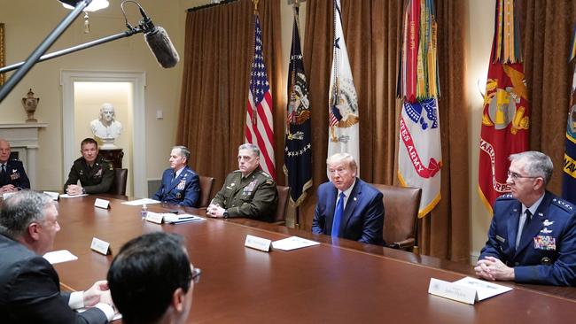 Donald Trump flanked by Chairman of the Joint Chiefs of Staff General Mark Milley (3rd R) and Vice Chairman of the Joint Chiefs of Staff General John Hyten (R) meets with military leaders and national security team in the Cabinet Room. Picture: AFP.