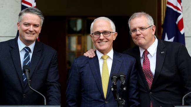 Mathias Cormann was still on board with the incumbent on Wednesday when he appeared with Malcolm Turnbull and Scott Morrison. Picture: Kym Smith