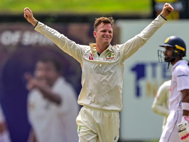 Australia's Matthew Kuhnemann celebrates after taking the wicket of Sri Lanka's captain Dhananjaya de Silva during the third day of the first Test cricket match between Sri Lanka and Australia at the Galle International Cricket Stadium in Galle on January 31, 2025. (Photo by Ishara S. KODIKARA / AFP)