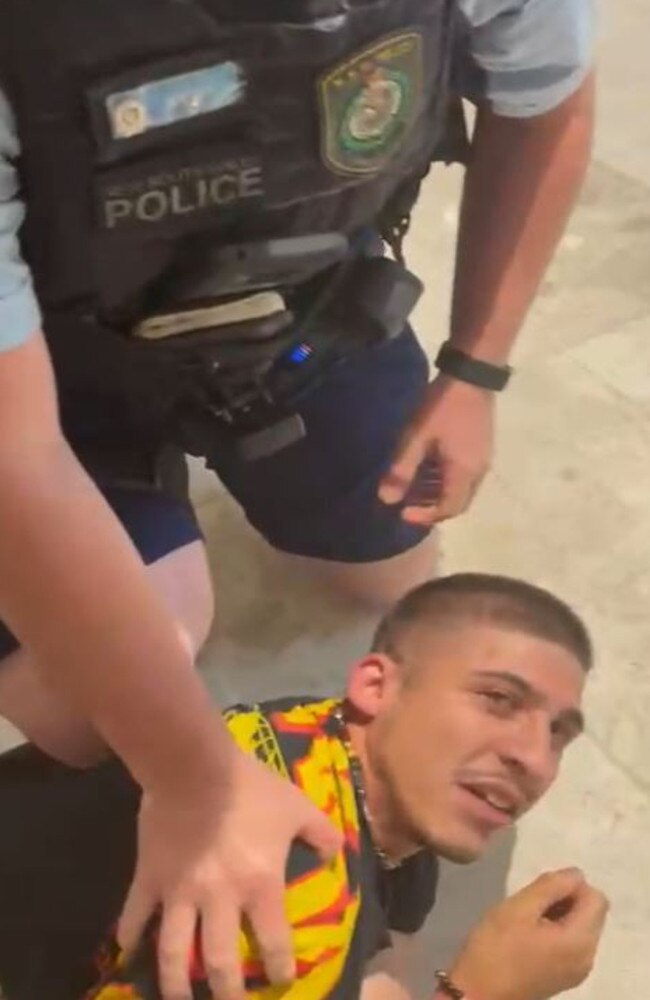 Video grabs of rapper ChillinIT, aka Blake Turmell, being arrested for not wearing a Covid mask in Westfield Hurstville.