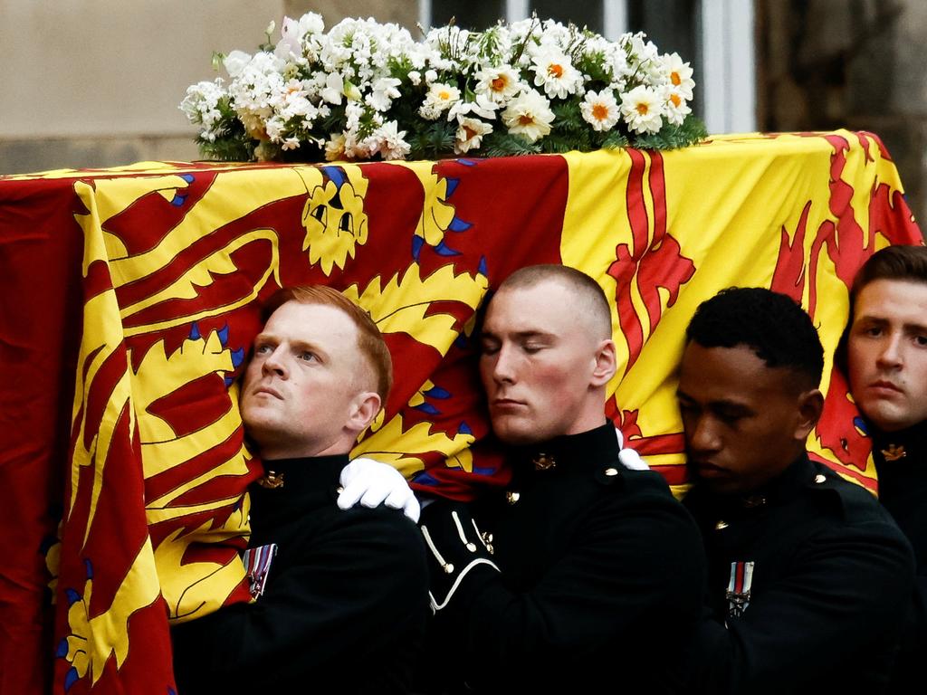 Pallbearers carry the coffin of the Queen as the hearse arrives at the Palace of Holyroodhouse in Edinburgh. Picture: Getty Images