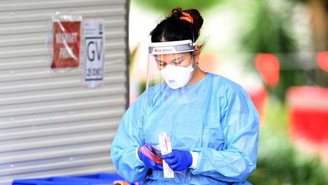 A health worker performs duties at a Covid-19 testing clinic in Brisbane. Picture: NCA NewsWire / Dan Peled