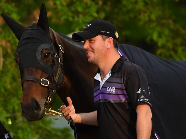 Strapper Umut Odemislioglu walks Winx after her gallop at Breakfast with the Best on Tuesday morning. Picture: Getty Images