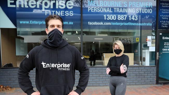 Gym owner Mark Ottobre, with member Ellen Williams, wants PTs to be able to operate one-on-one inside gyms. Picture: Alex Coppel.