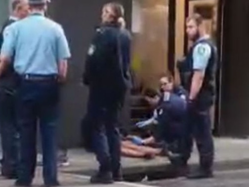 Police surround the man following his arrest. Picture: Supplied