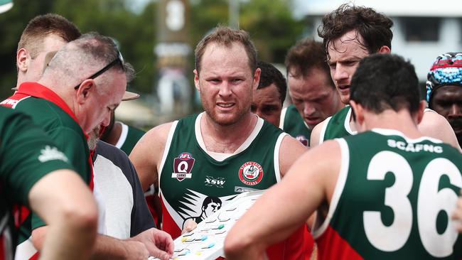 Cutters' Cameron Campbell with his teammates in a AFL Cairns men's preliminary final match. Picture: Brendan Radke