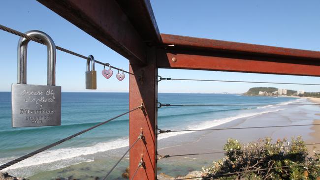 Council has cut “love locks’’ from the protective wires on fences around several Gold Coast clifftops to prevent overstraining.