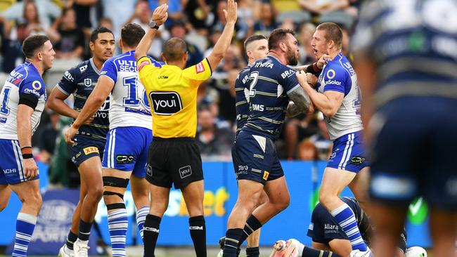 Kyle Feldt takes on Jack Hetherington for a hit on Valentine Holmes. Picture: Alix Sweeney