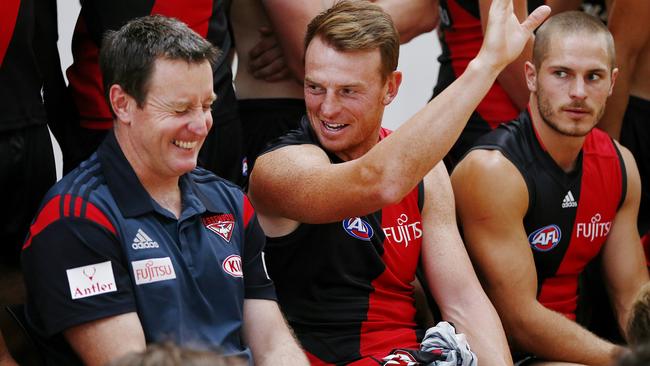 Essendon team photo at Tullamarine, Brendan Goddard shares a laugh with coach John Worsfold during the team photo. Melbourne. 15th February 2016. Picture: Colleen Petch.