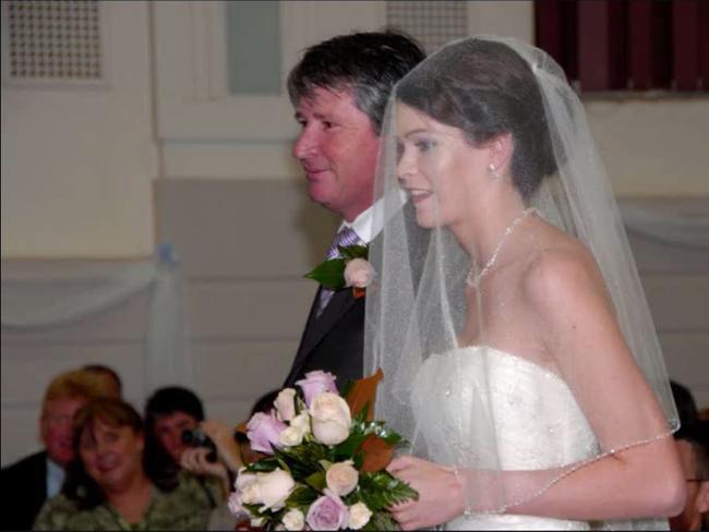 Megan’s stepfather walks her down the aisle on her wedding day. Picture: Facebook