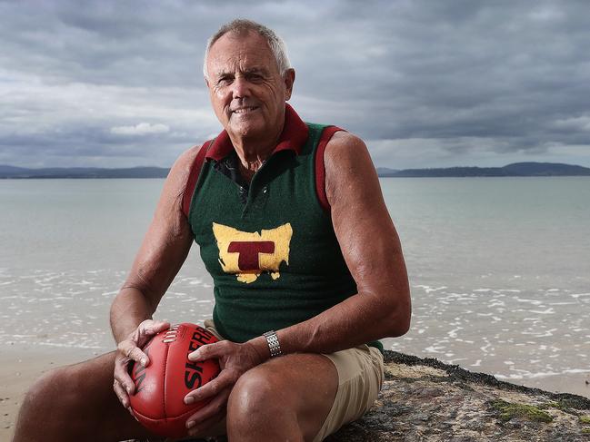 Former Tasmanian footballer Bob Cheek with one of his Tasmania gurnesys. Picture: Luke Bowden