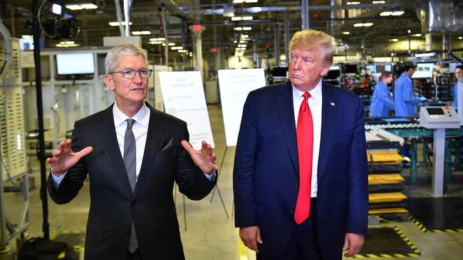 Donald Trump and Apple CEO Tim Cook speak to the press during a tour of the Flextronics computer manufacturing facility where Apple's Mac Pros are assembled in Austin, Texas in November, 2019. Picture: Mandel Ngan/AFP