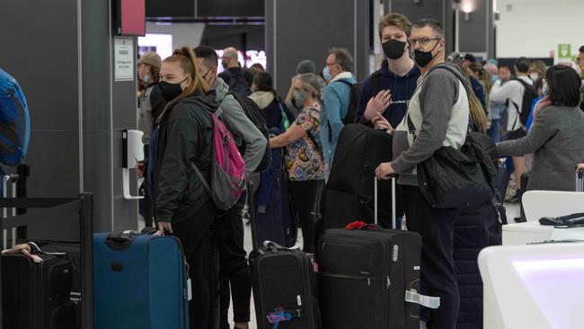 The school holiday rush at Melbourne Airport on Sunday. Picture: Tony Gough