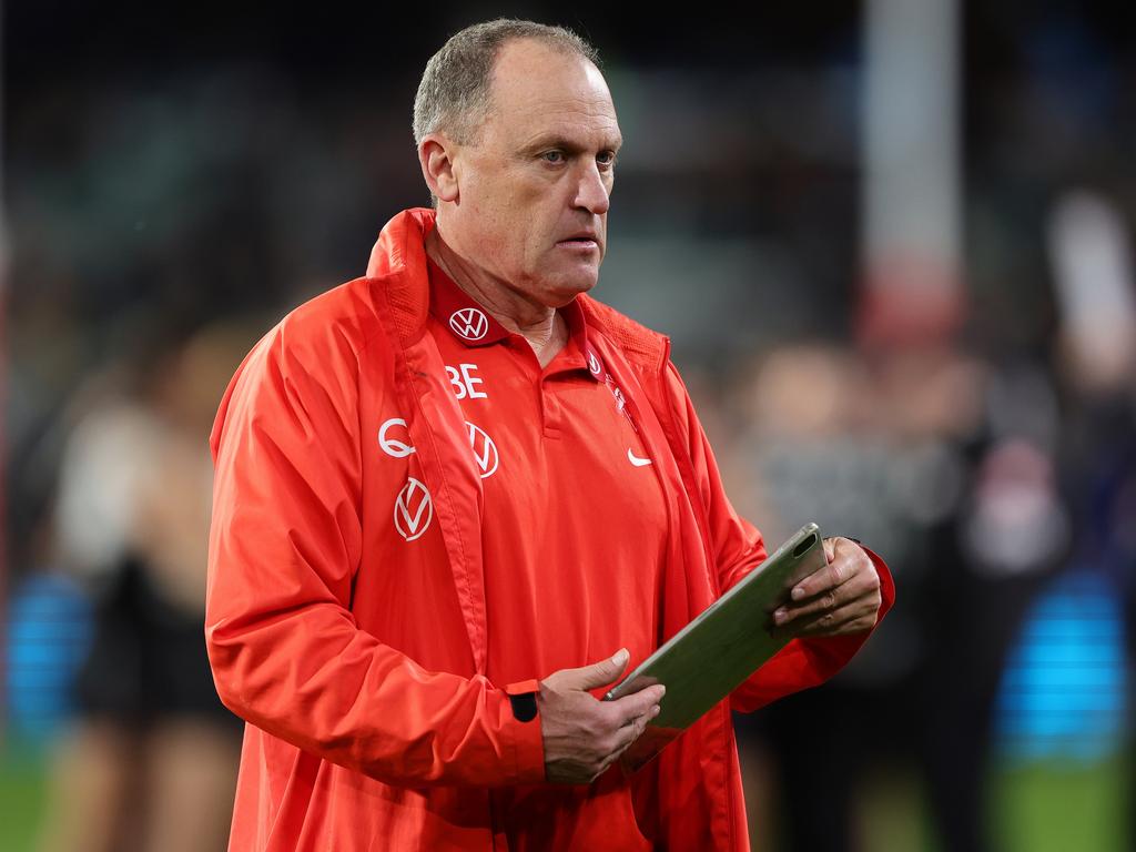 Swans coach John Longmire walks from the field on Saturday night. Picture: Sarah Reed/AFL Photos via Getty Images.