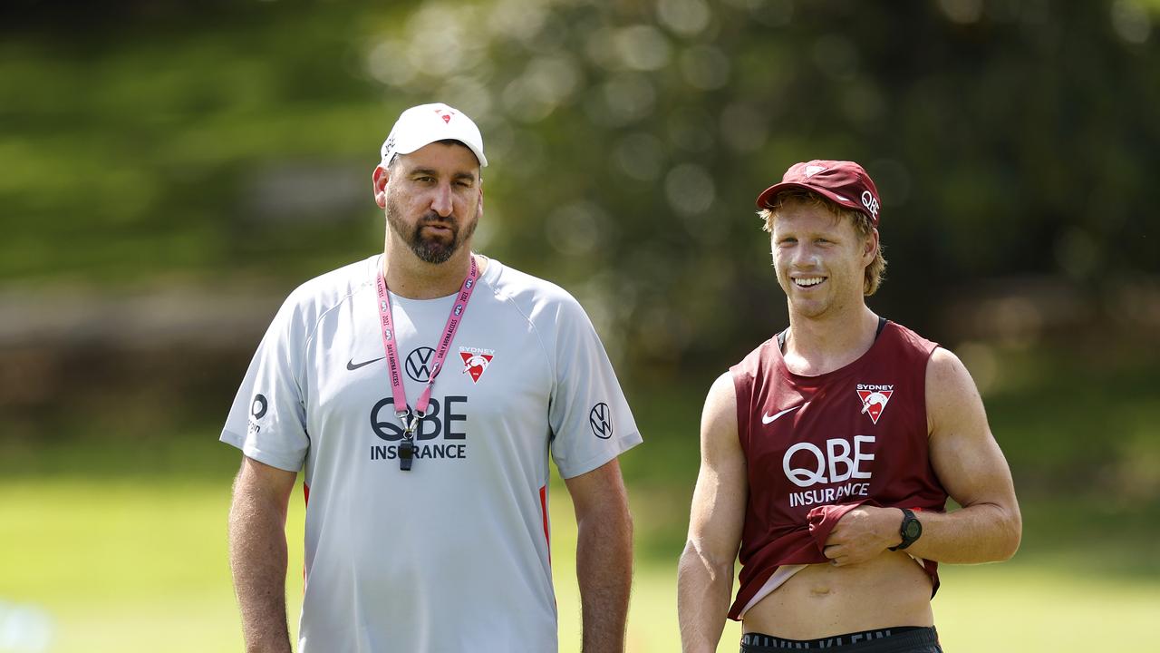 Swans captain Callum Mills (right) with Dean Cox at training, after the longtime assistant took the reins from premiership coach John Longmire last week. Picture: Phil Hillyard