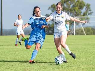 ON THE BALL: South West Queensland Thunder player Jess Fry (left) battles her Gold Coast opponent for possession of the ball. Picture: DSL Photography