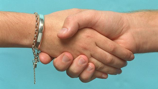 MARCH 1, 2002 : Generic photo of two people shaking hands, 01/03/02. Pic Steve Morenos.Hand Shake