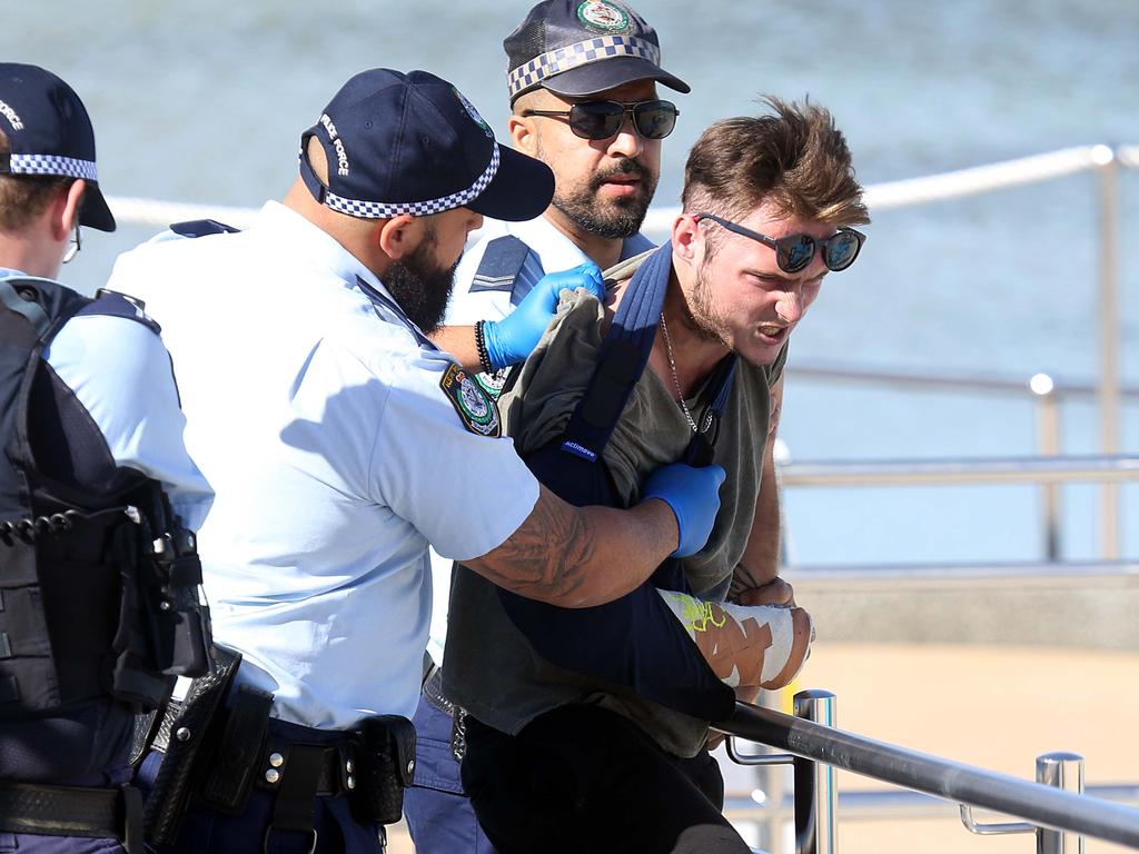 Photographs show a man was arrested at Bondi Beach this morning. Picture: Matrix