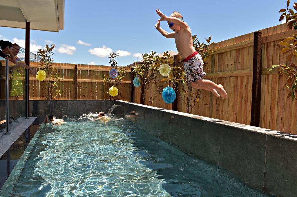 Pool party to raise awareness for The House The Coast Built at Flame tree Pockett and acknowledge PoolFab who have contributed over $30,000 for the pool and landscaping. Riley Woodward enjoys the pool. Photo: Warren Lynam / Sunshine Coast Daily. Picture: Warren Lynam