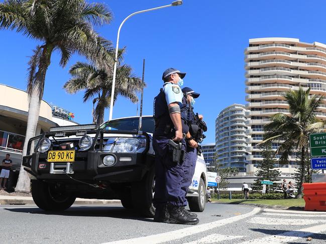 Police at the Queensland-NSW border at Tweed Heads. There are concerns a growing Covid cluster in the Tweed may have spread into Queensland. Picture: NCA Newswire / Scott Powick