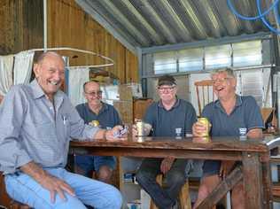 RUSTIC RAFFLE: Gayndah Men's Shed members with the bar table and stools they've been working on. Picture: Felicity Ripper