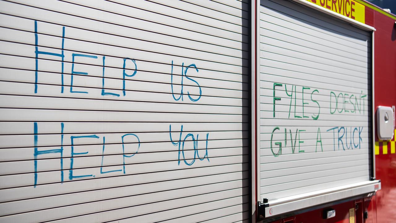 Firefighters have written slogans on their trucks calling on the NT government to step up in their pay negotiation with the United Workers Union. Picture: Pema Tamang Pakhrin