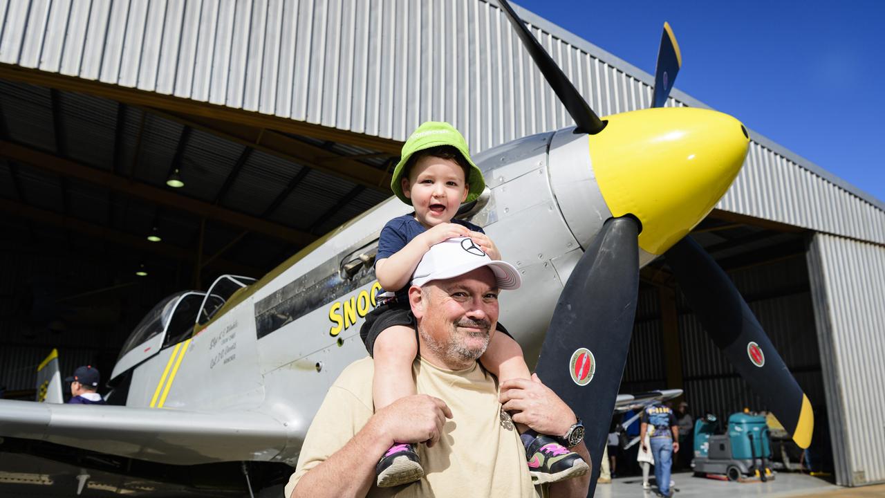 Vance Dean gets a good look at the P-51 Mustang WWII fighter from the shoulders of uncle Craig Scotts at the David Hack Classic, Sunday, May 18, 2025. Picture: Kevin Farmer