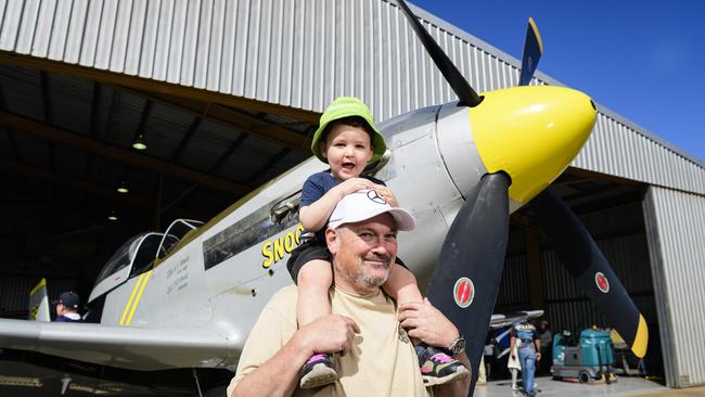 Vance Dean gets a good look at the P-51 Mustang WWII fighter from the shoulders of uncle Craig Scotts at the David Hack Classic, Sunday, May 18, 2025. Picture: Kevin Farmer
