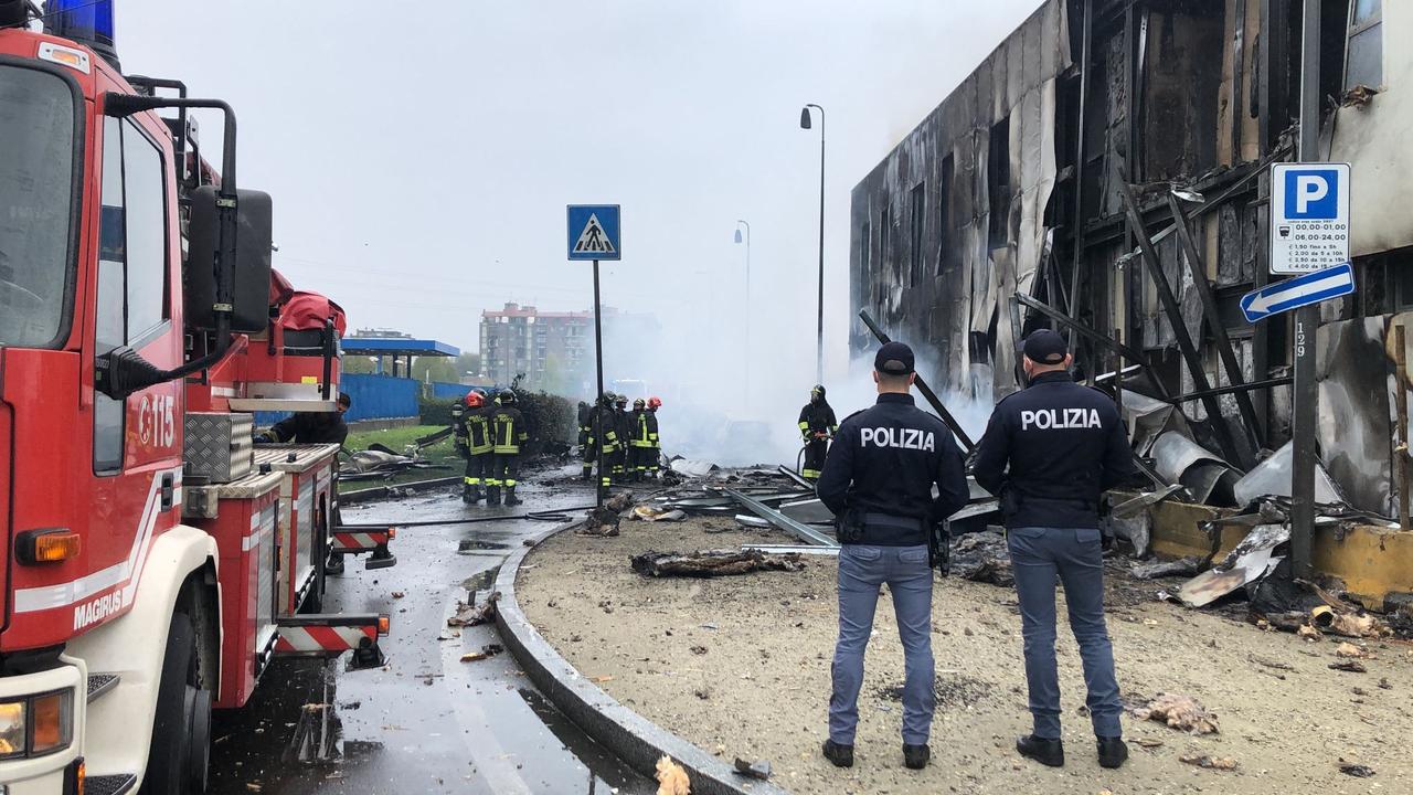 Police and firefighters investigate the scene of the crash. Picture: Polizia di Stato/AFP