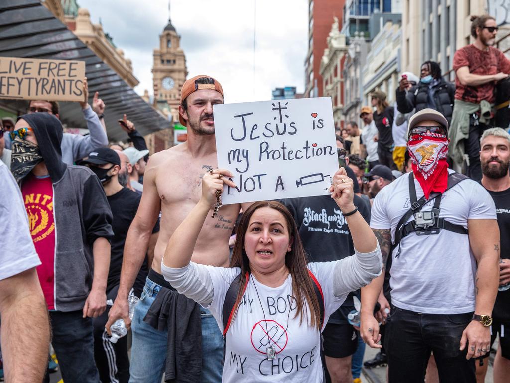 Protesters held signs and marched through the CBD. Picture: NCA NewsWire/Sarah Matray