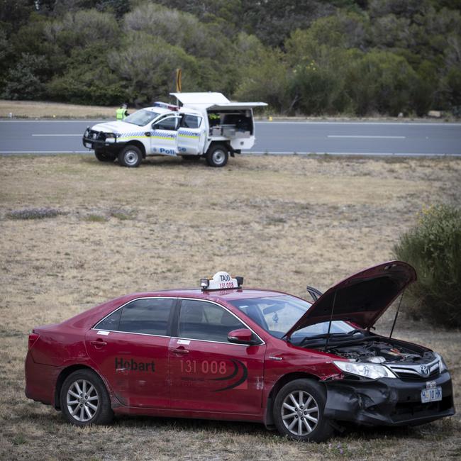 The damaged taxi at the Mornington turn-off from the Tasman Highway. Picture: LUKE BOWDEN