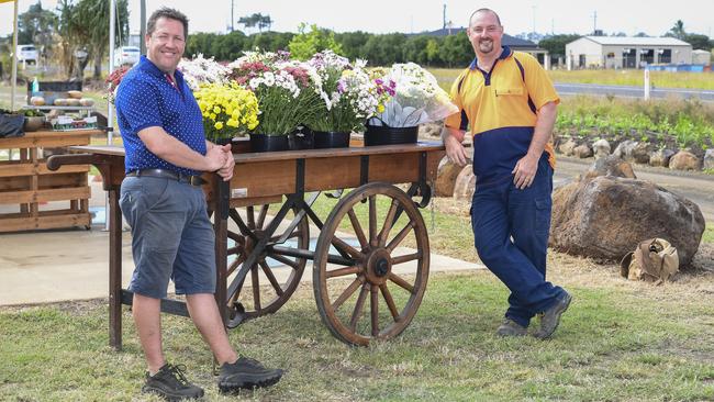 COMMUNITY SPIRIT BLOSSOMS: Anthony Rehbein and Robert Campbell at the popup flower stall.