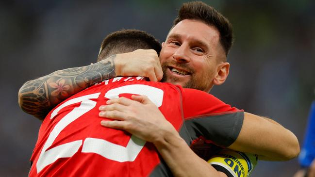 Messi celebrates with shootout hero, Argentina keeper Emilio Martinez. (Photo by Odd ANDERSEN / AFP)