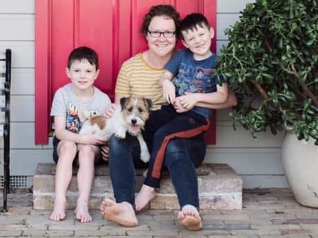 An image of the mother and two boys posing by a home alongside a small dog. Picture: Facebook/Trish Smith