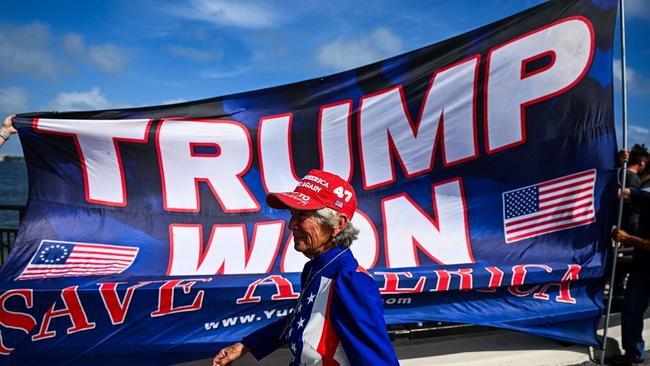 Supporters of former US president and Republican presidential candidate Donald Trump celebrate his victory near his Mar-a-Lago resort in Palm Beach, Florida. Picture: AFP